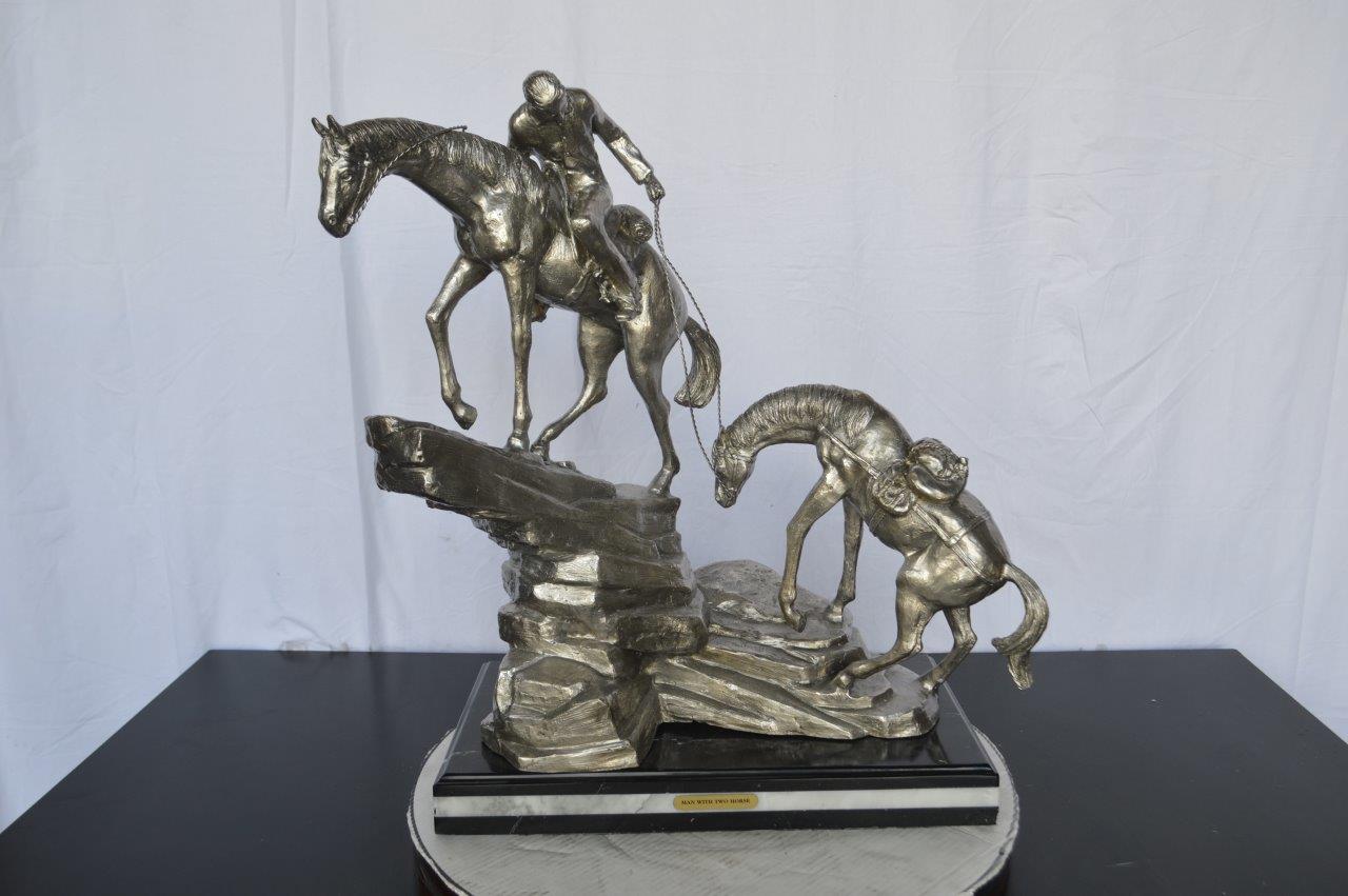 Man with two horses silver finish Bronze Statue - Size: 25"L x 13"W x 26"H.