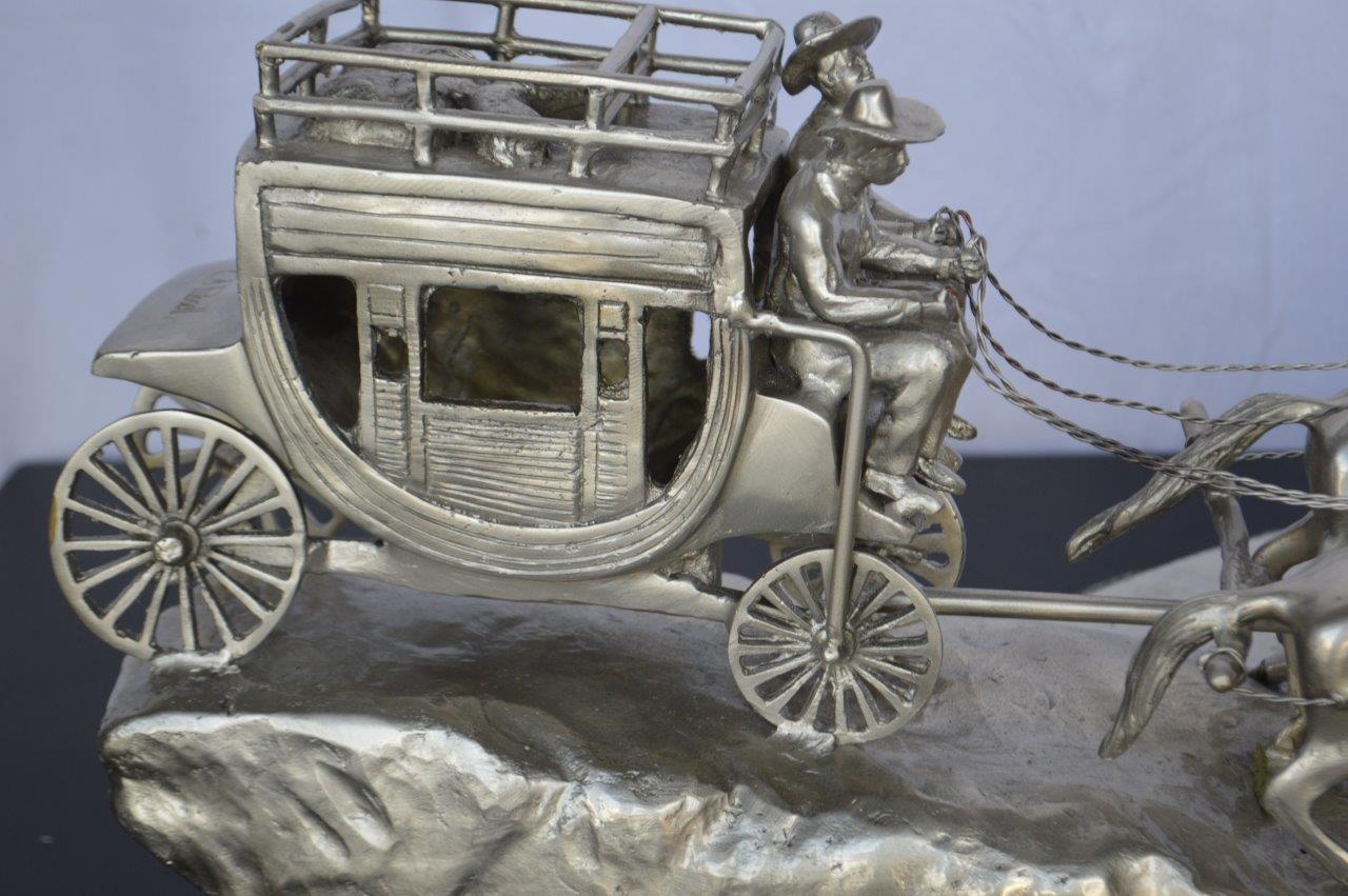 M Russell, Silver Stagecoach Replica Bronze Statue - Size: 38"L x 10"W x 12"H.