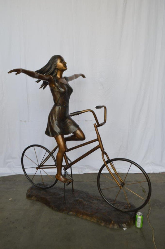 Girl Riding Hands Free life Size Bronze Statue -  Size: 53"L x 62"W x 61"H.