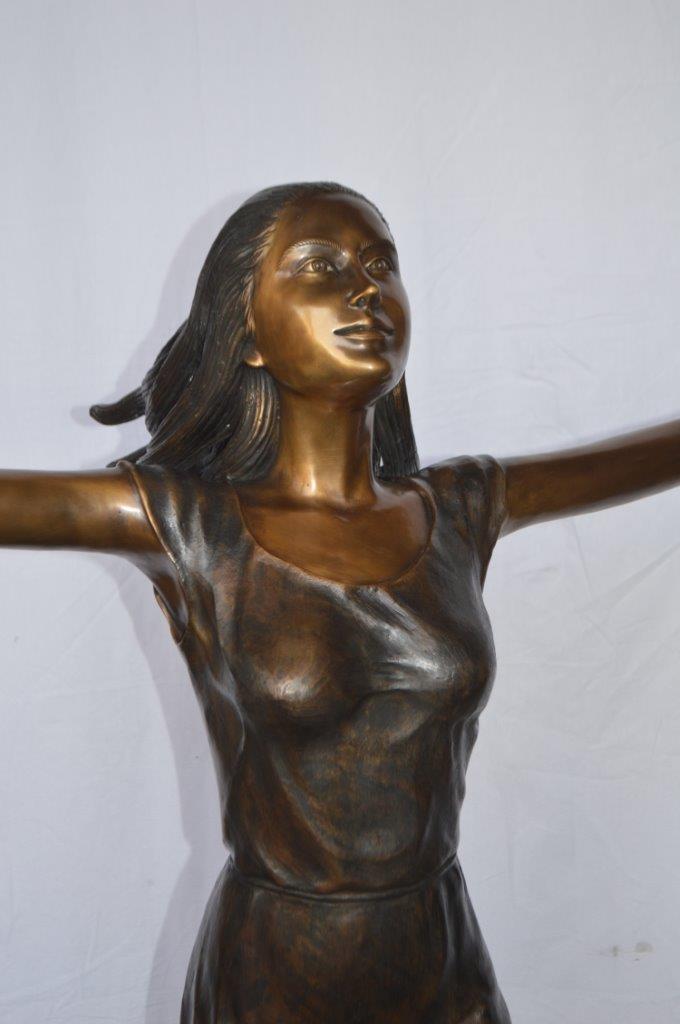 Girl Riding Hands Free life Size Bronze Statue - Size: 53"L x 62"W x 61"H.