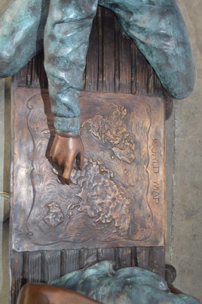 Young Couple Reviewing a World Map Bronze Statue - Size: 32"L x 47"W x 42"H.