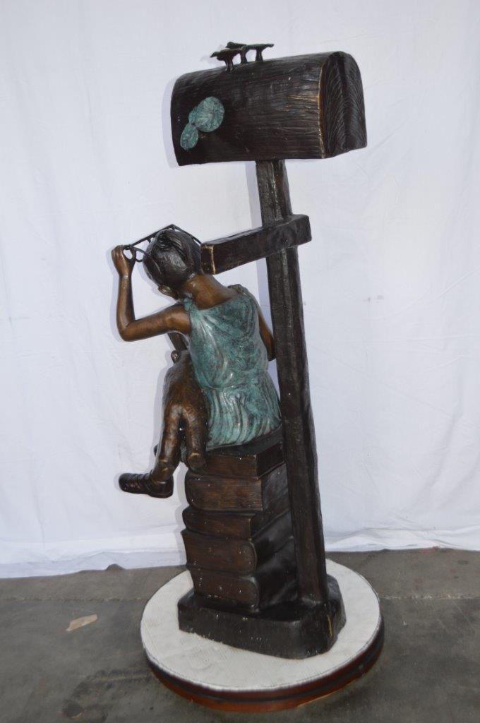 Mailbox - Girl sitting on books and reading - Size: 26"L x 22"W x 53"H.