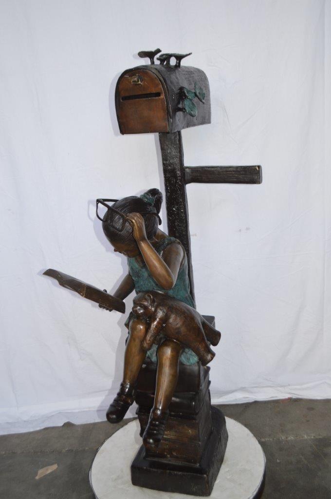 Mailbox - Girl sitting on books and reading - Size: 26"L x 22"W x 53"H.
