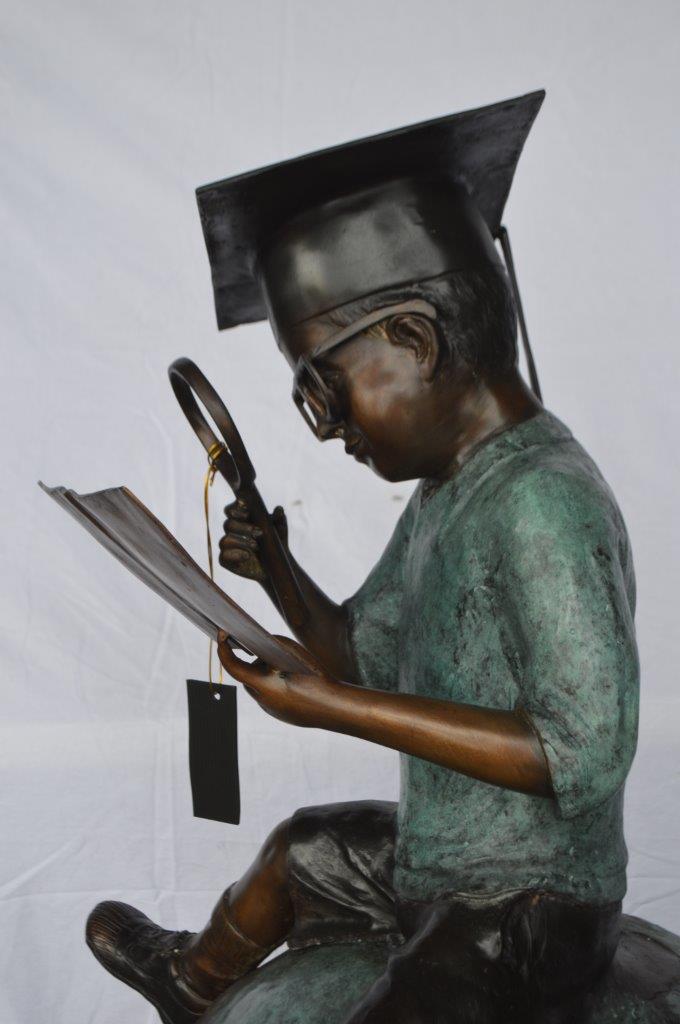 Student learning on top of world bronze statue - Size: 28"L x 24"W x 52"H.