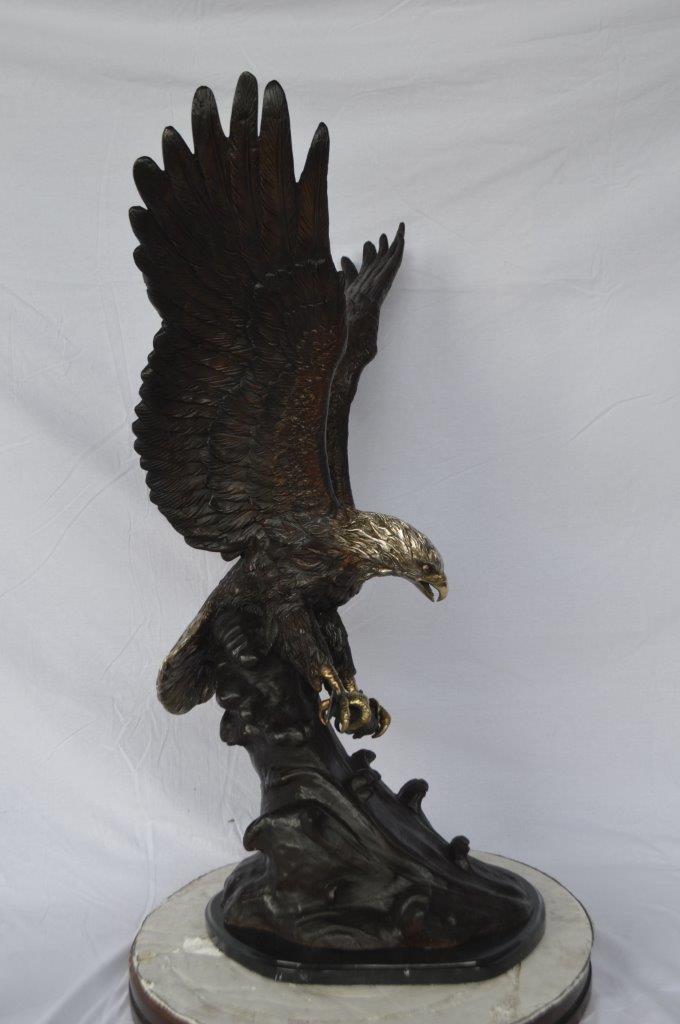 Eagle perched bronze statue - Size: 28"L x 18"W x 41"H.