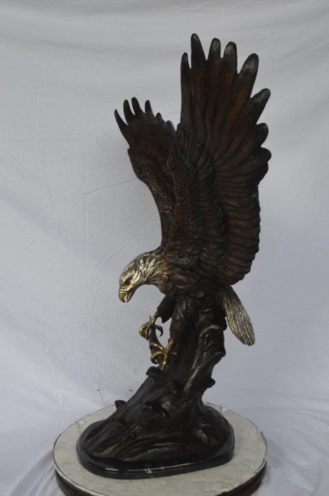 Eagle perched bronze statue - Size: 28"L x 18"W x 41"H.