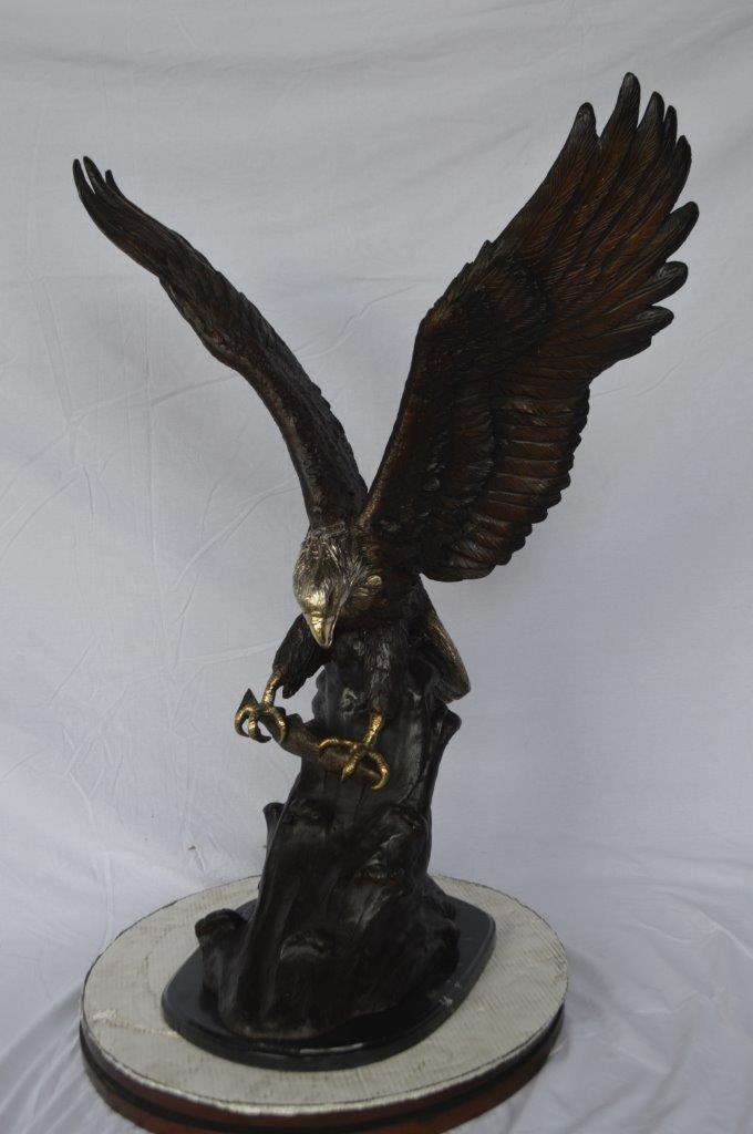 Eagle perched bronze statue - Size: 28"L x 18"W x 41"H.