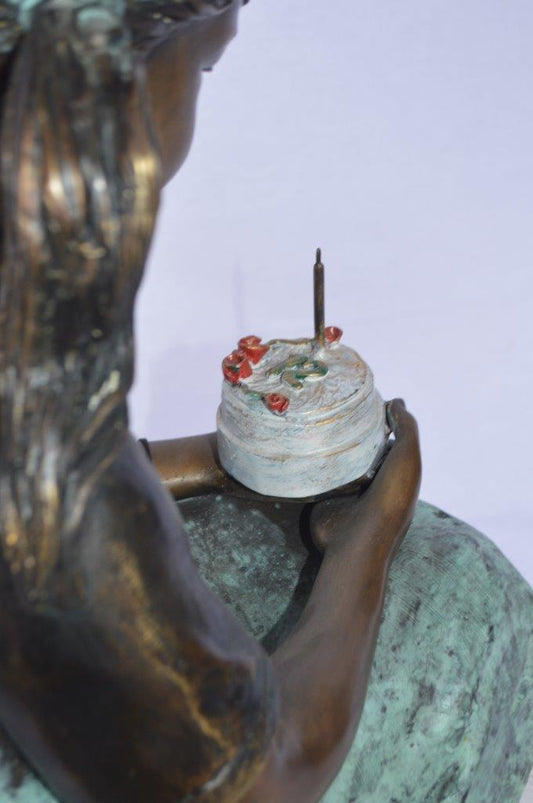 Girl with birthday cake bronze statue -  Size: 13"L x 10"W x 27"H.