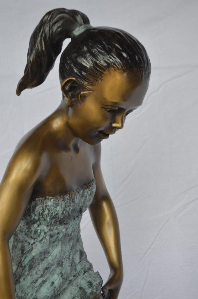 Girl looking at a frog bronze statue - Size: 16"L x 13"W x 36"H.
