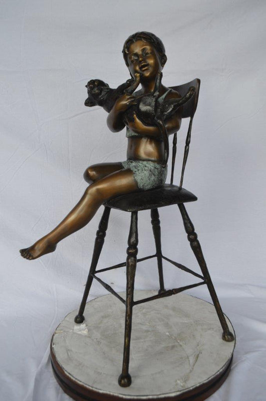 Girl with a cat on a high chair bronze statue -  Size: 16"L x 16"W x 38"H.
