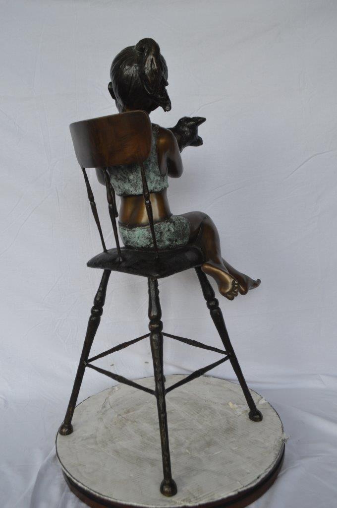Girl with a cat on a high chair bronze statue -  Size: 16"L x 16"W x 38"H.