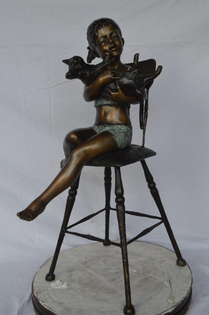 Girl with a cat on a high chair bronze statue - Size: 16"L x 16"W x 38"H.