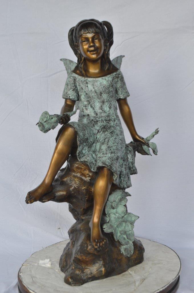 Angel girl sitting with a rose bronze statue -  Size: 22"L x 27"W x 37"H.