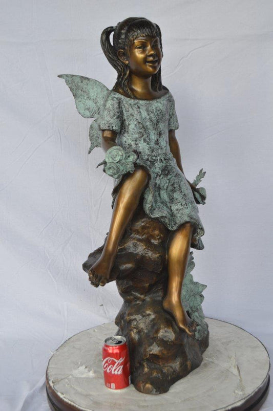 Angel girl sitting with a rose bronze statue - Size: 22"L x 27"W x 37"H.