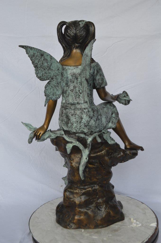 Angel girl sitting with a rose bronze statue - Size: 22"L x 27"W x 37"H.