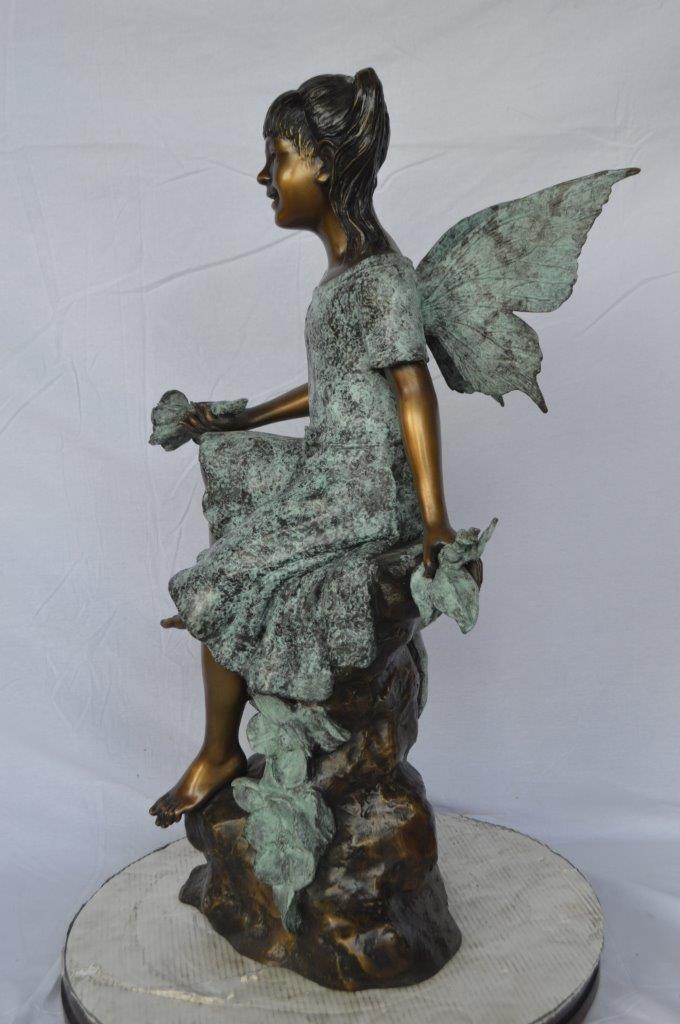 Angel girl sitting with a rose bronze statue -  Size: 22"L x 27"W x 37"H.