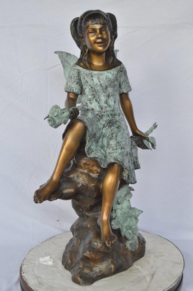 Angel girl sitting with a rose bronze statue -  Size: 22"L x 27"W x 37"H.