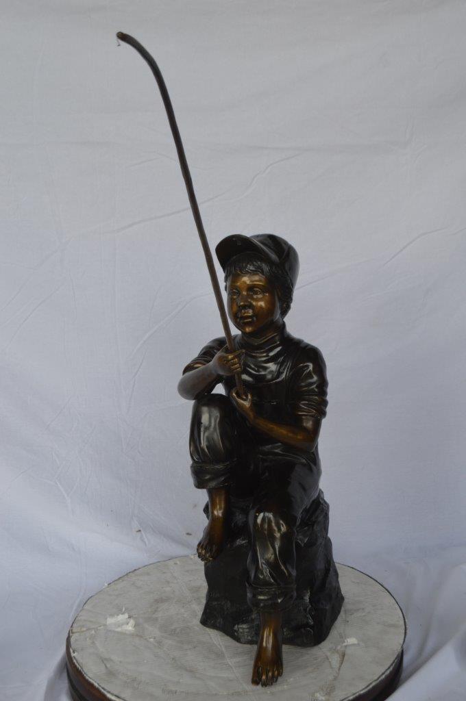 Young Boy sitting on a rock fishing bronze statue - Size: 31"L x 9"W x 33"H.