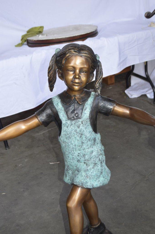 Three children happily holding hands bronze statue -  Size: 31"L x 19"W x 41"H.