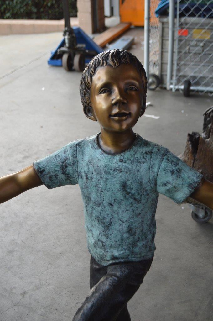 Three children happily holding hands bronze statue - Size: 31"L x 19"W x 41"H.