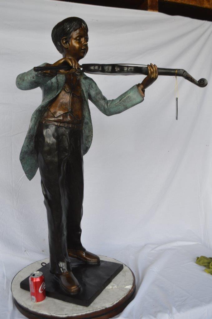 Boy playing violin large bronze statue - Size: 31"L x 31"W x 50"H.