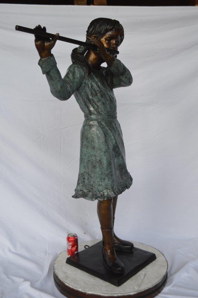 Girl playing flute large bronze statue - Size: 30"L x 15"W x 50"H.
