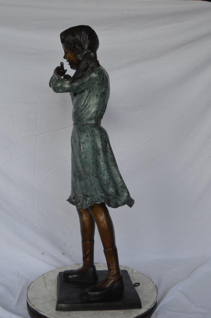Girl playing flute large bronze statue - Size: 30"L x 15"W x 50"H.