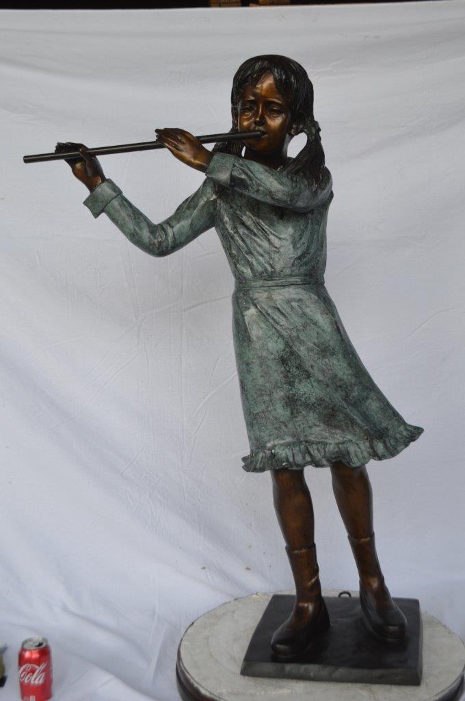 Girl playing flute large bronze statue - Size: 30"L x 15"W x 50"H.