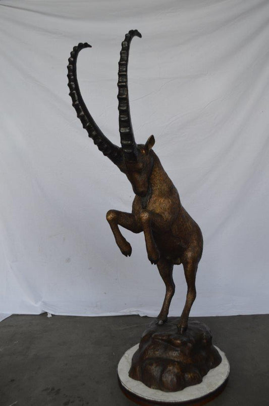 Mountain goat on hind legs bronze statue -  Size: 36"L x 16"W x 66"H.