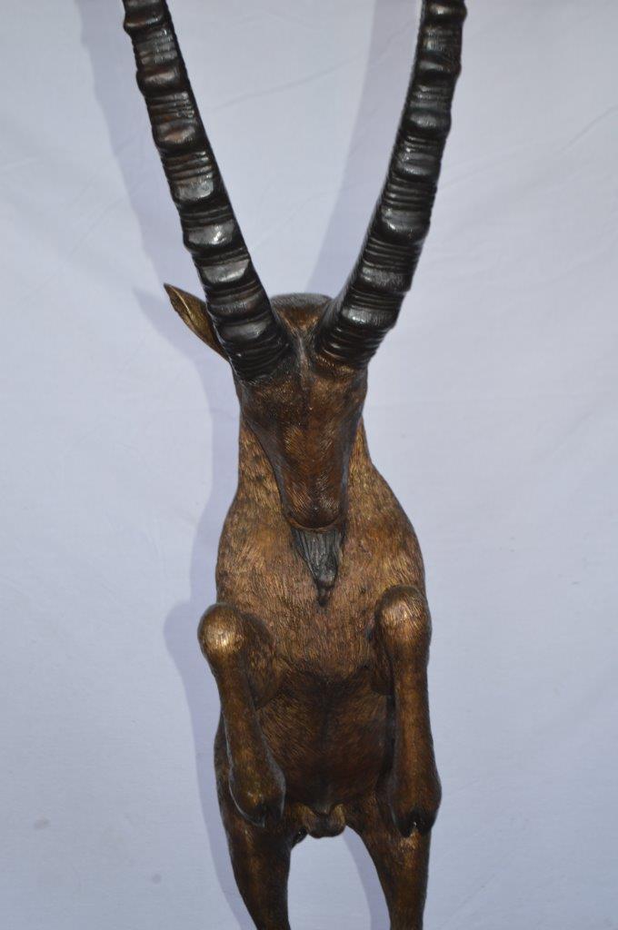 Mountain goat on hind legs bronze statue - Size: 36"L x 16"W x 66"H.