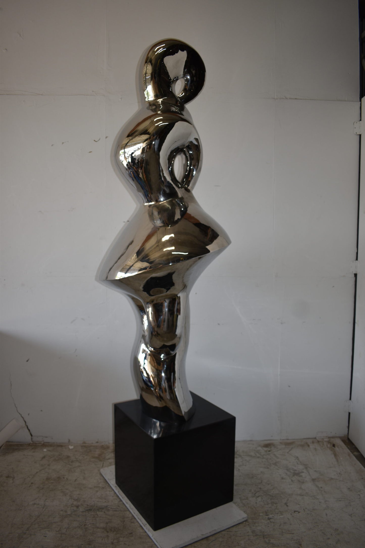 Ambiguous Stainless-Steel Statue On Marble Base Size: 28" x 28" x 100"H
