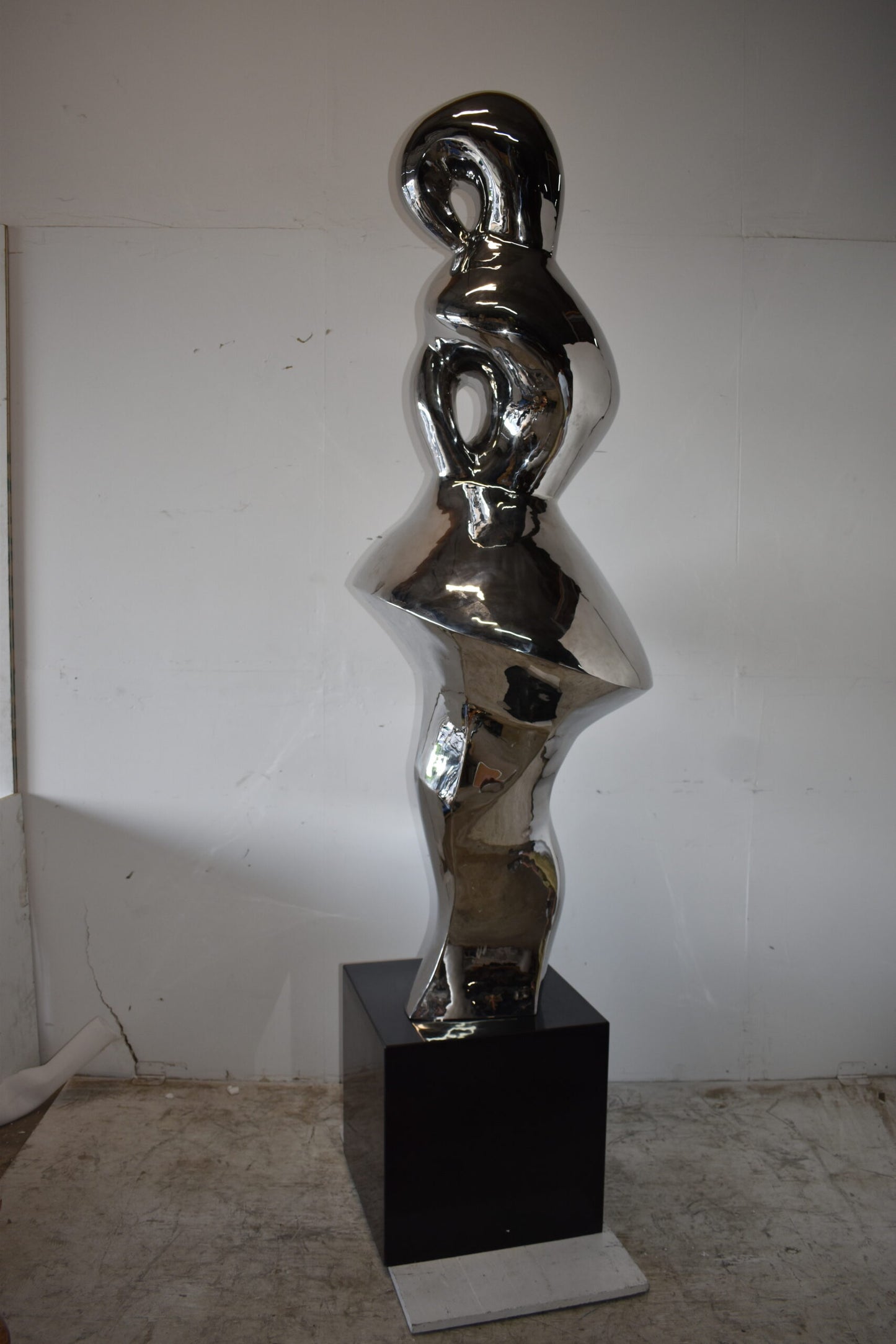 Ambiguous Stainless-Steel Statue On Marble Base Size: 28" x 28" x 100"H
