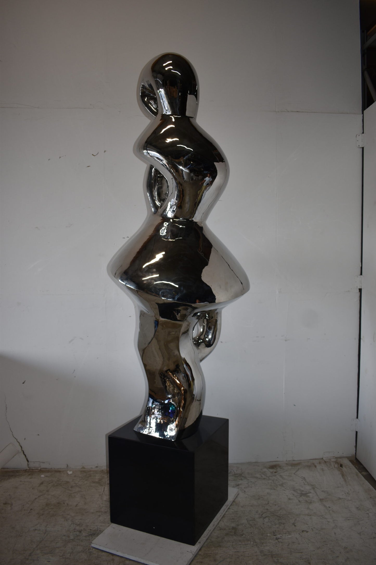 Ambiguous Stainless-Steel Statue On Marble Base Size: 28" x 28" x 100"H