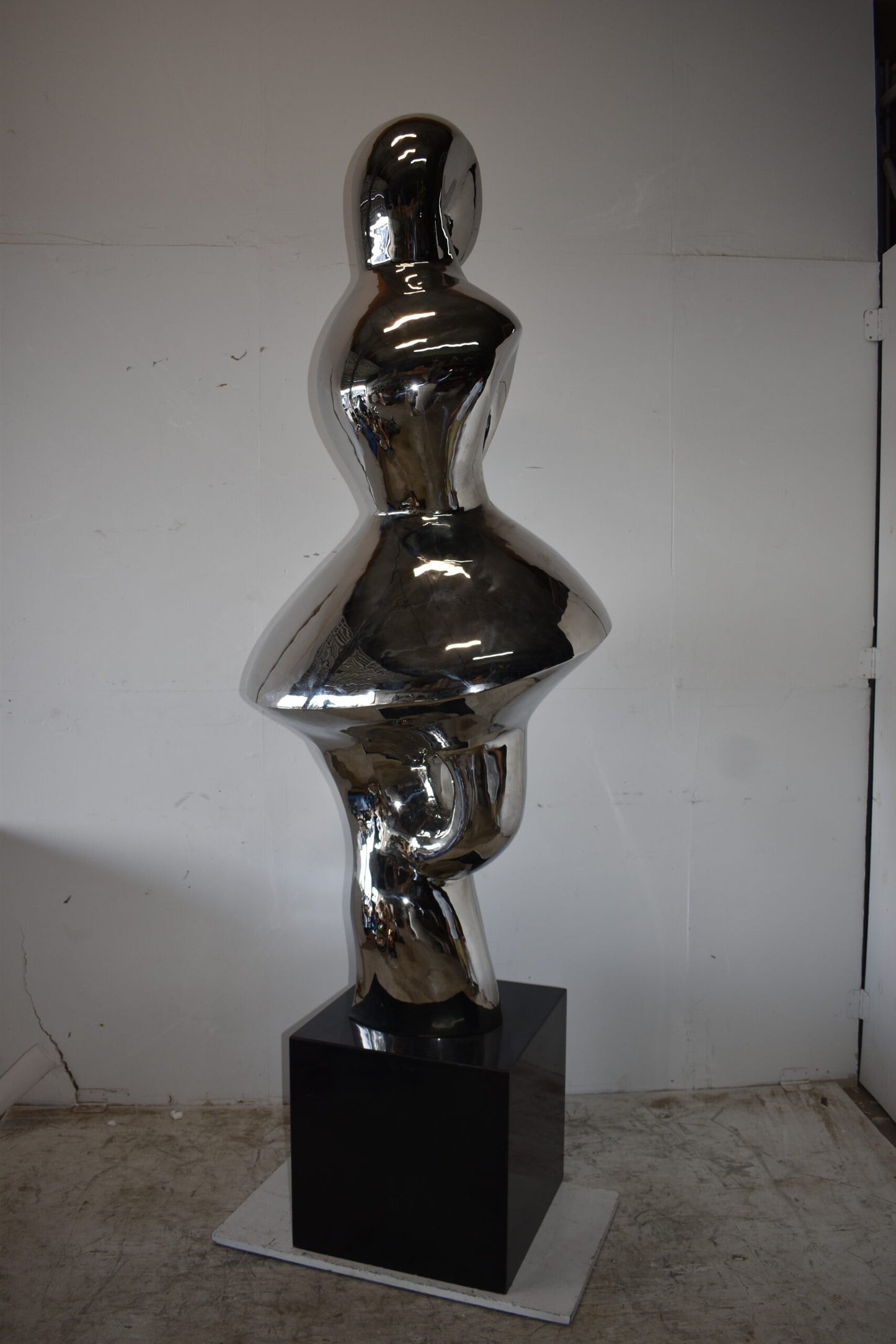 Ambiguous Stainless-Steel Statue On Marble Base Size: 28" x 28" x 100"H