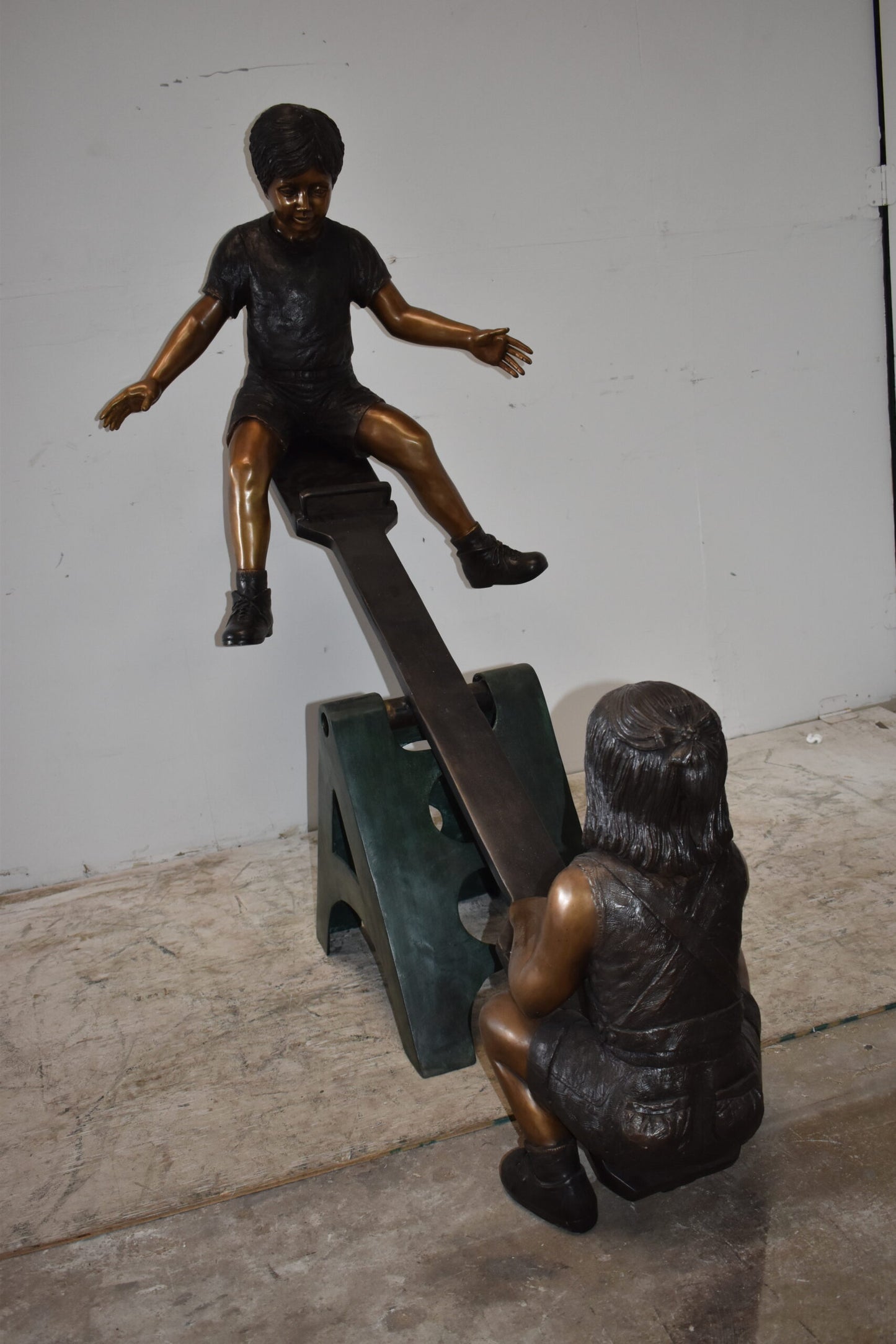 Playful Children on a See-Saw Bronze Statue Size: 76" x 27" x 59"H