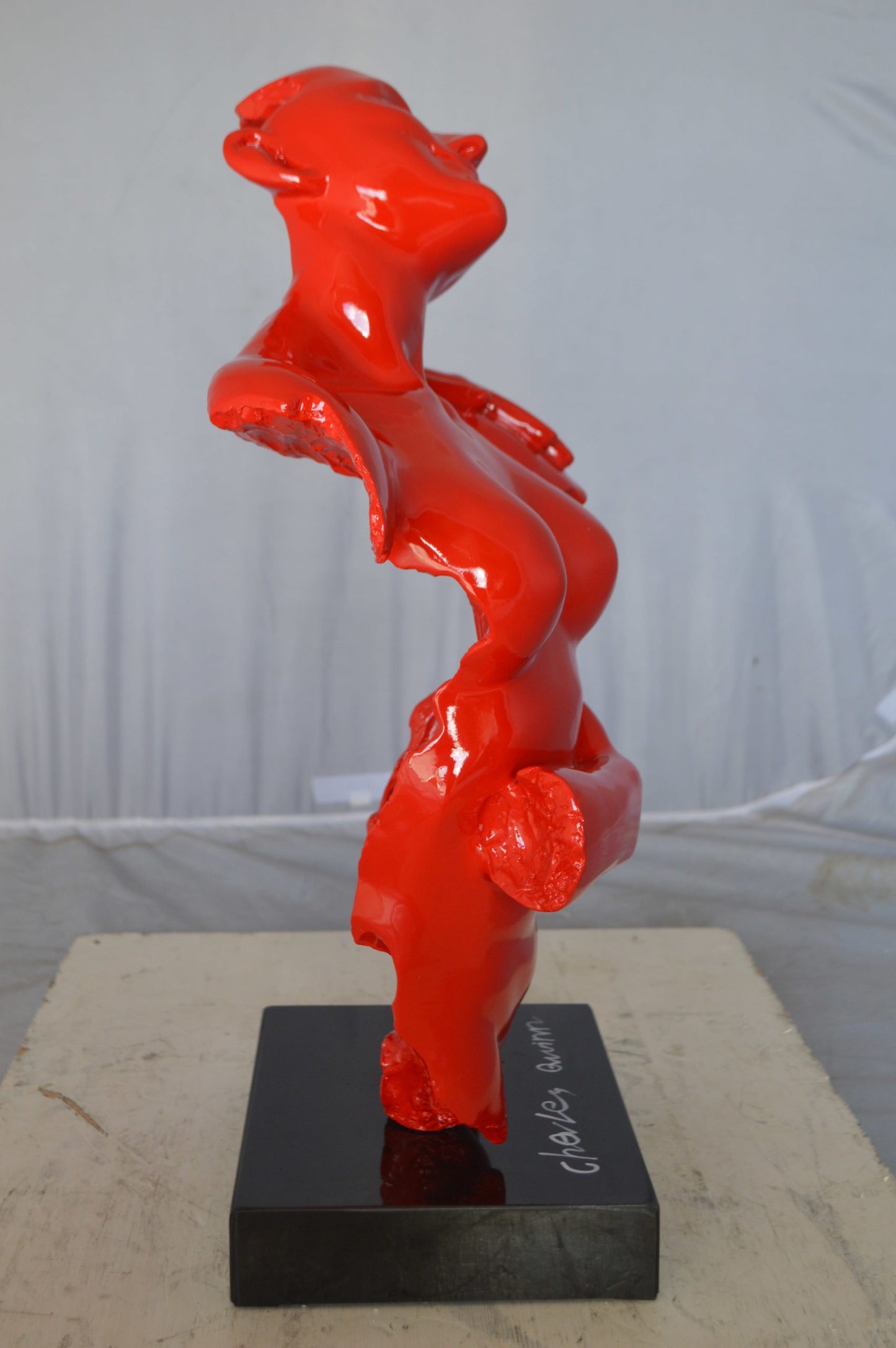 Modern resin statue of a woman hugged by a men - Size: 13"L x 9"W x 24"H.