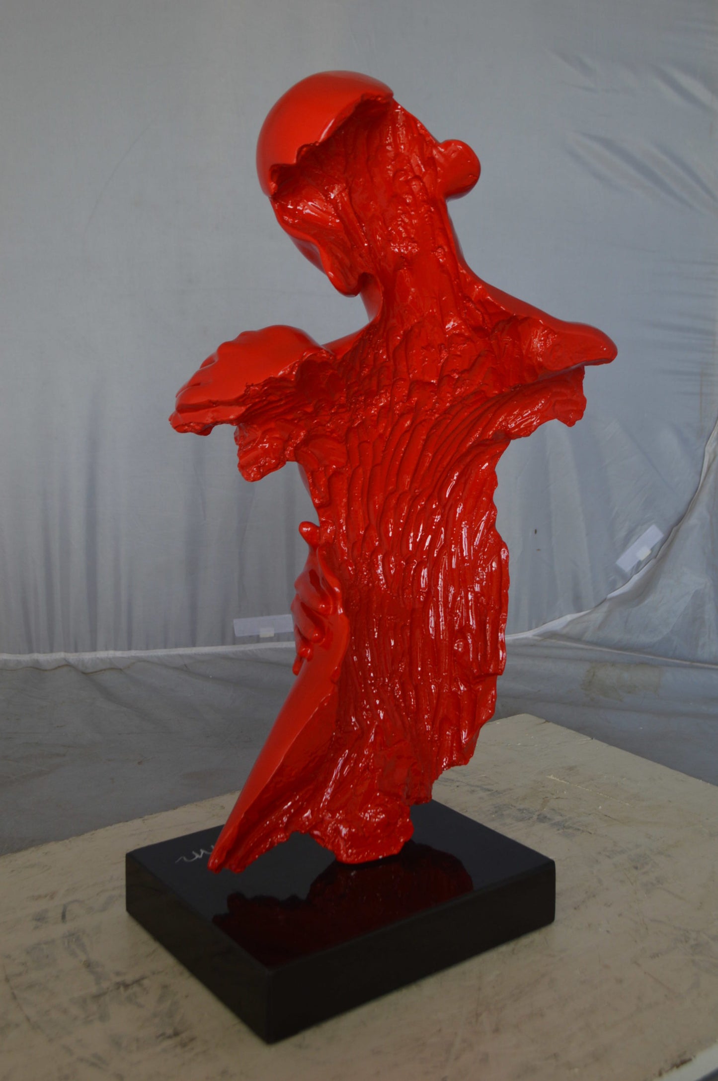 Modern resin statue of a woman hugged by a men - Size: 13"L x 9"W x 24"H.