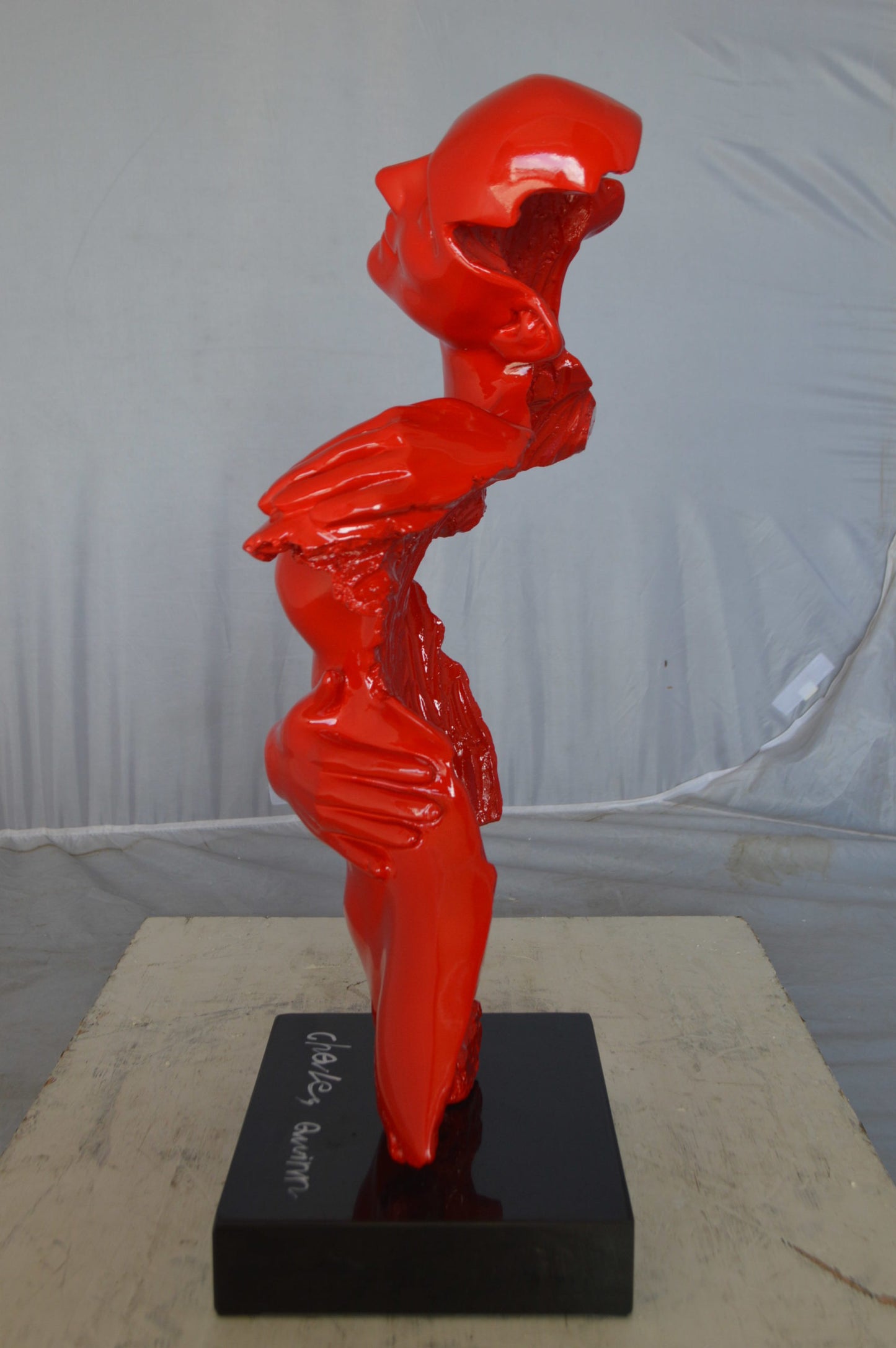 Modern resin statue of a woman hugged by a men - Size: 13"L x 9"W x 24"H.