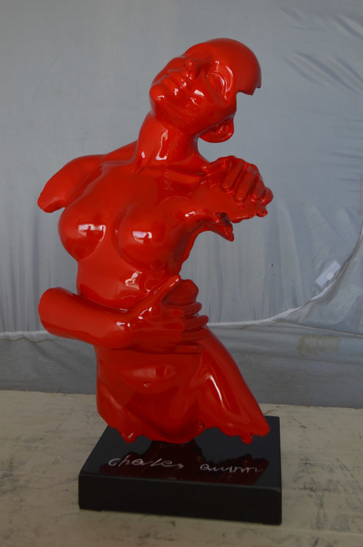 Modern resin statue of a woman hugged by a men - Size: 13"L x 9"W x 24"H.