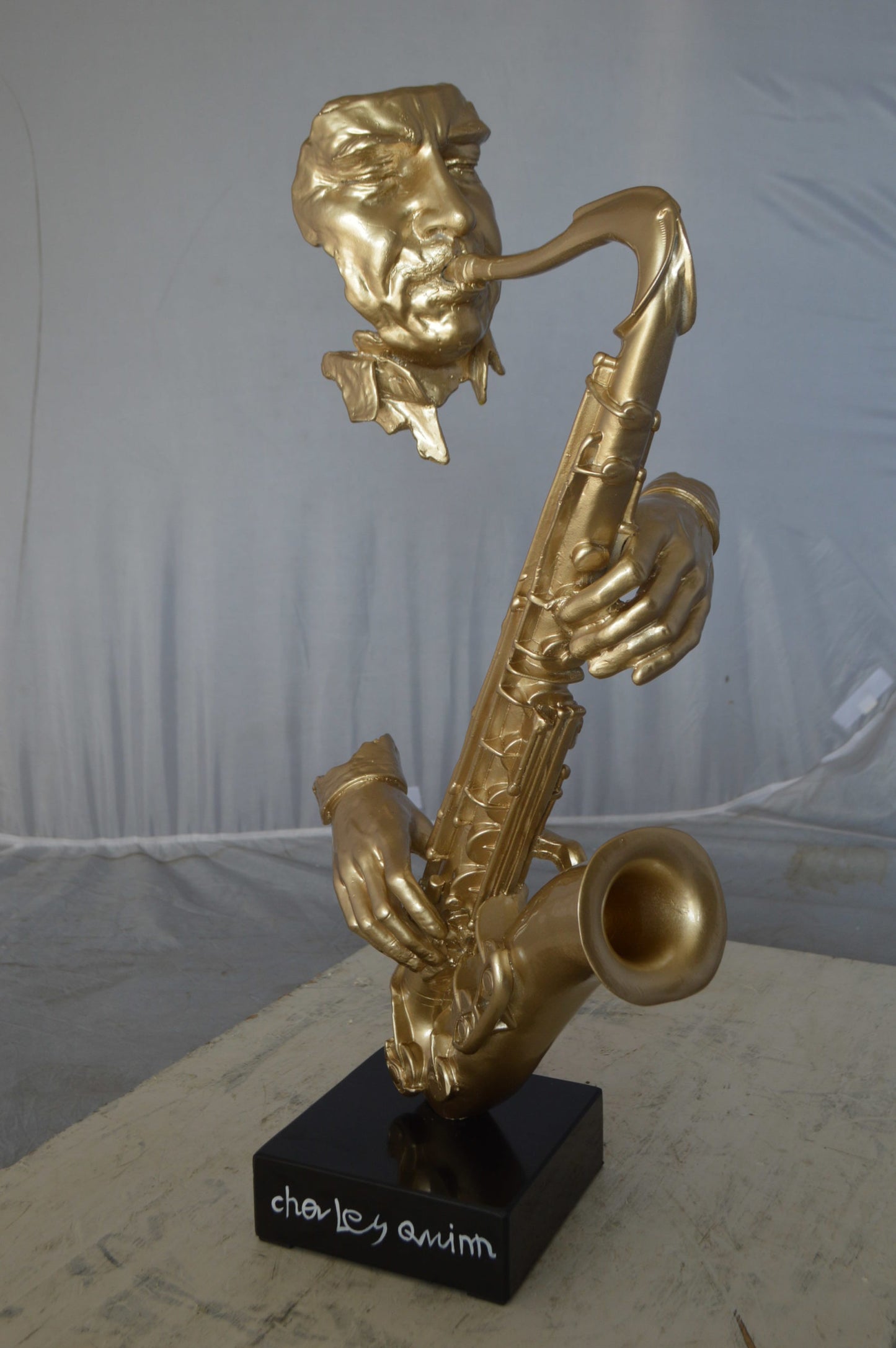 Modern art of a saxophone player resin statue -  Size: 13"L x 5"W x 25"H.