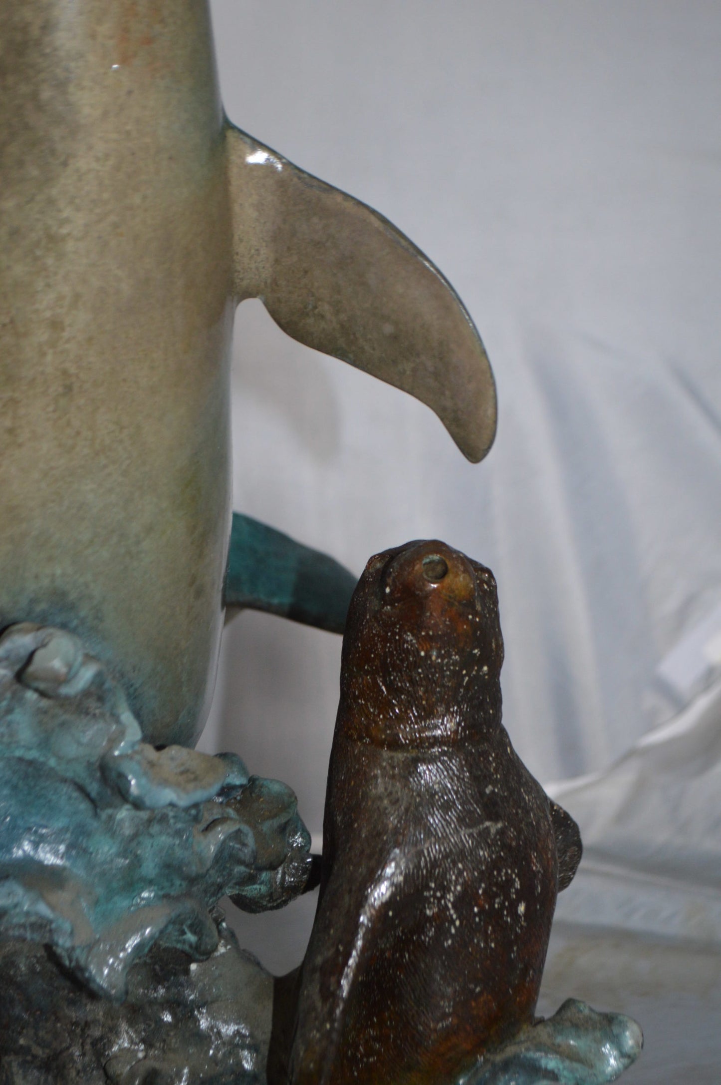 Girl feeding a dolphin and seals bronze fountain - Size: 28"L x 17"W x 37"H.