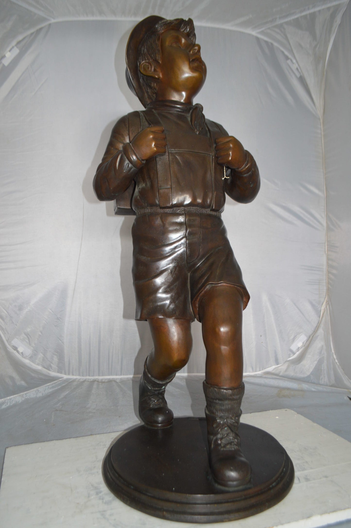Boy with backpack bronze statue - Size: 20"L x 18"W x 46"H.