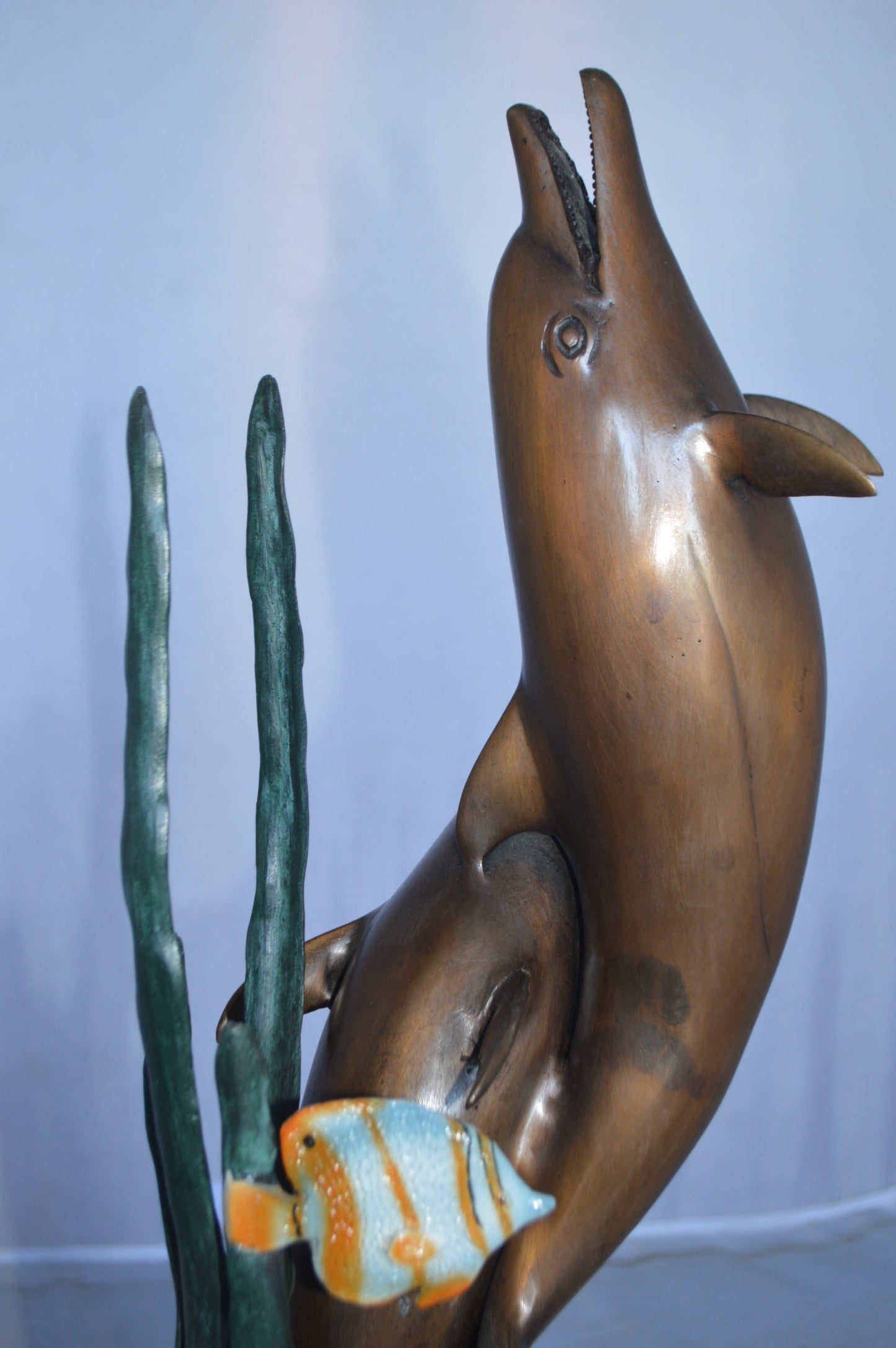 Two dolphins with fish, table top bronze statue. - Size: 8"L x 8"W x 22"H.