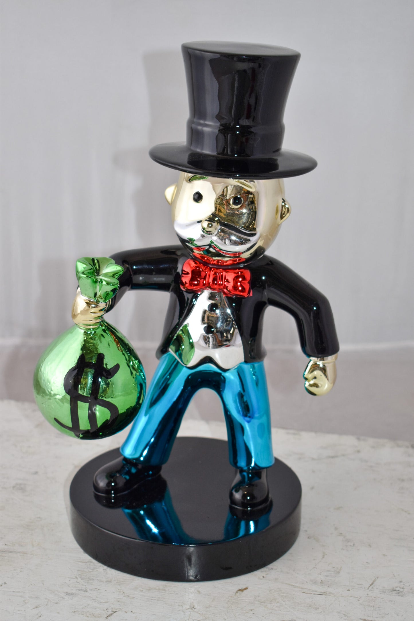 Frowning Monopoly Man Holding Money Bag Resin Statue Small Size: 7" x 8" x 15"H