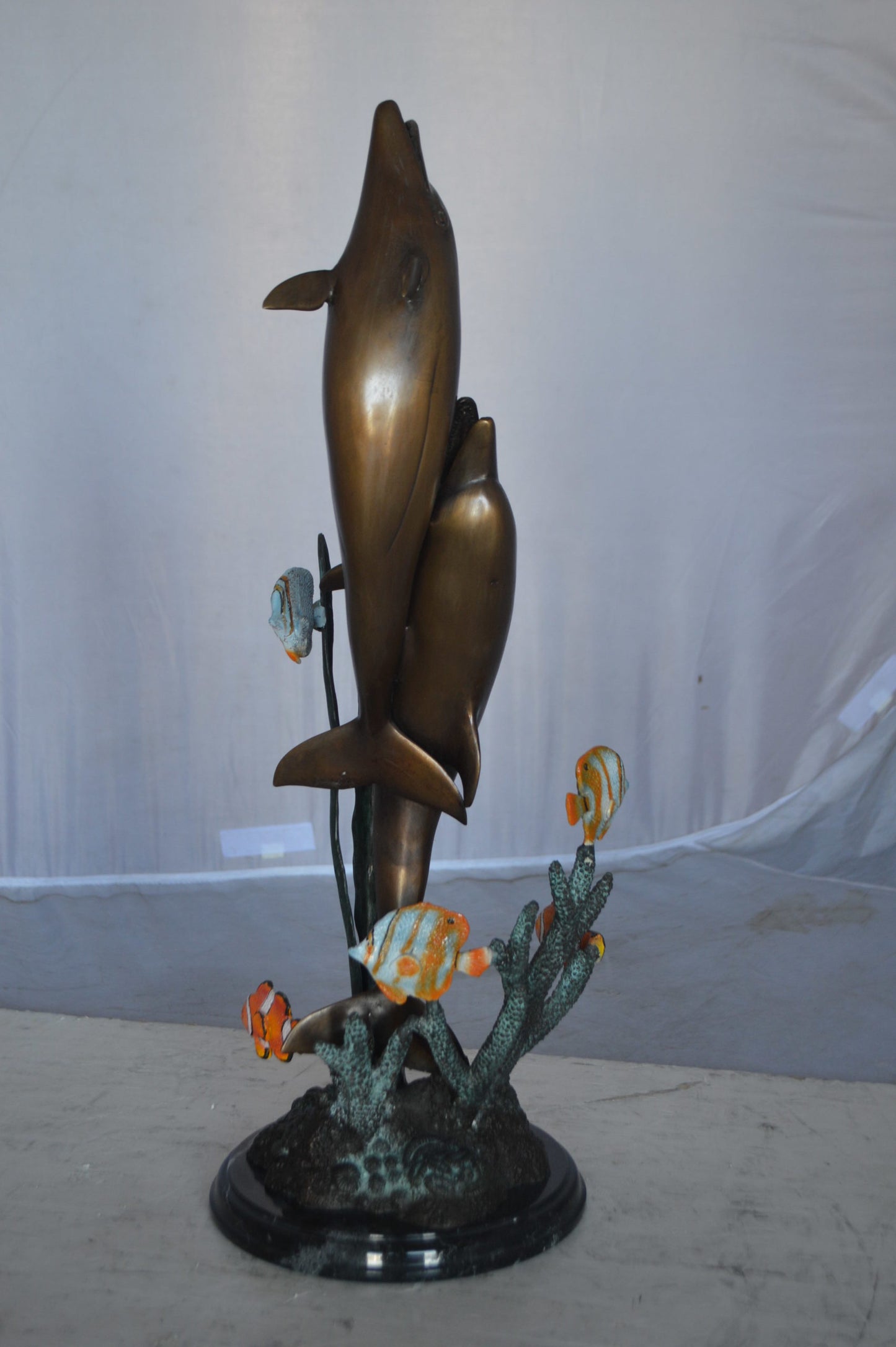 Two dolphins with fish, table top bronze statue. - Size: 8"L x 8"W x 22"H.