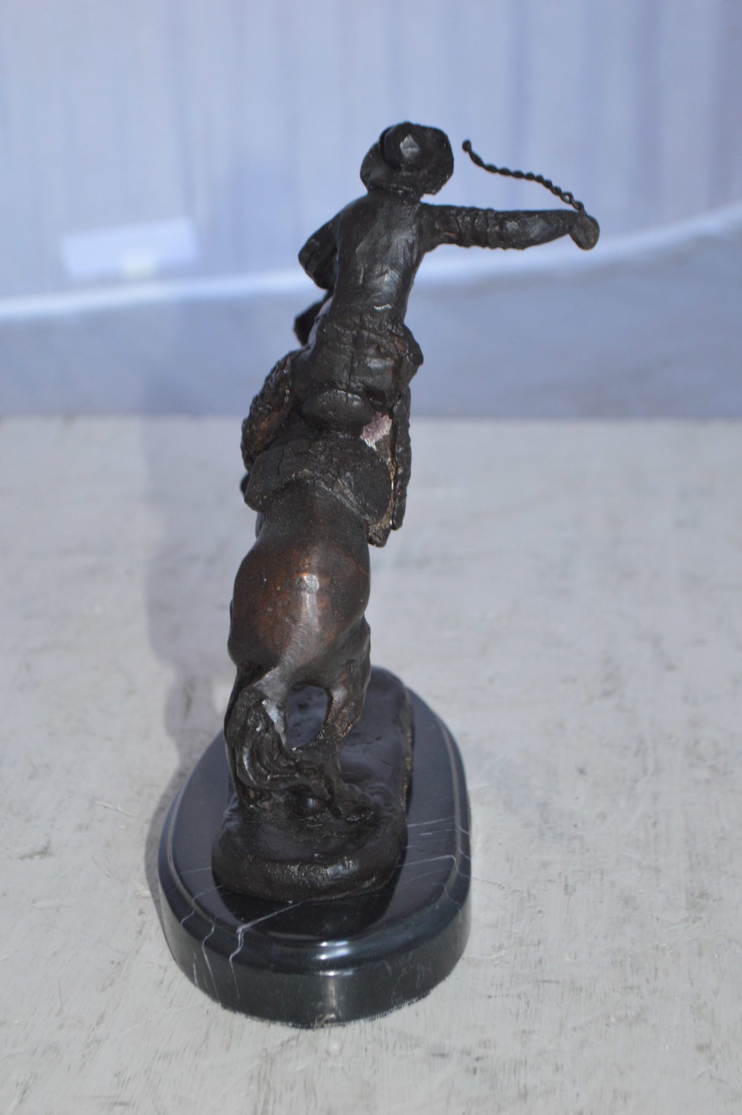 Wooly Chaps Bronze Statue by Remington 13H - Size: 8"L x 3"W x 9"H.