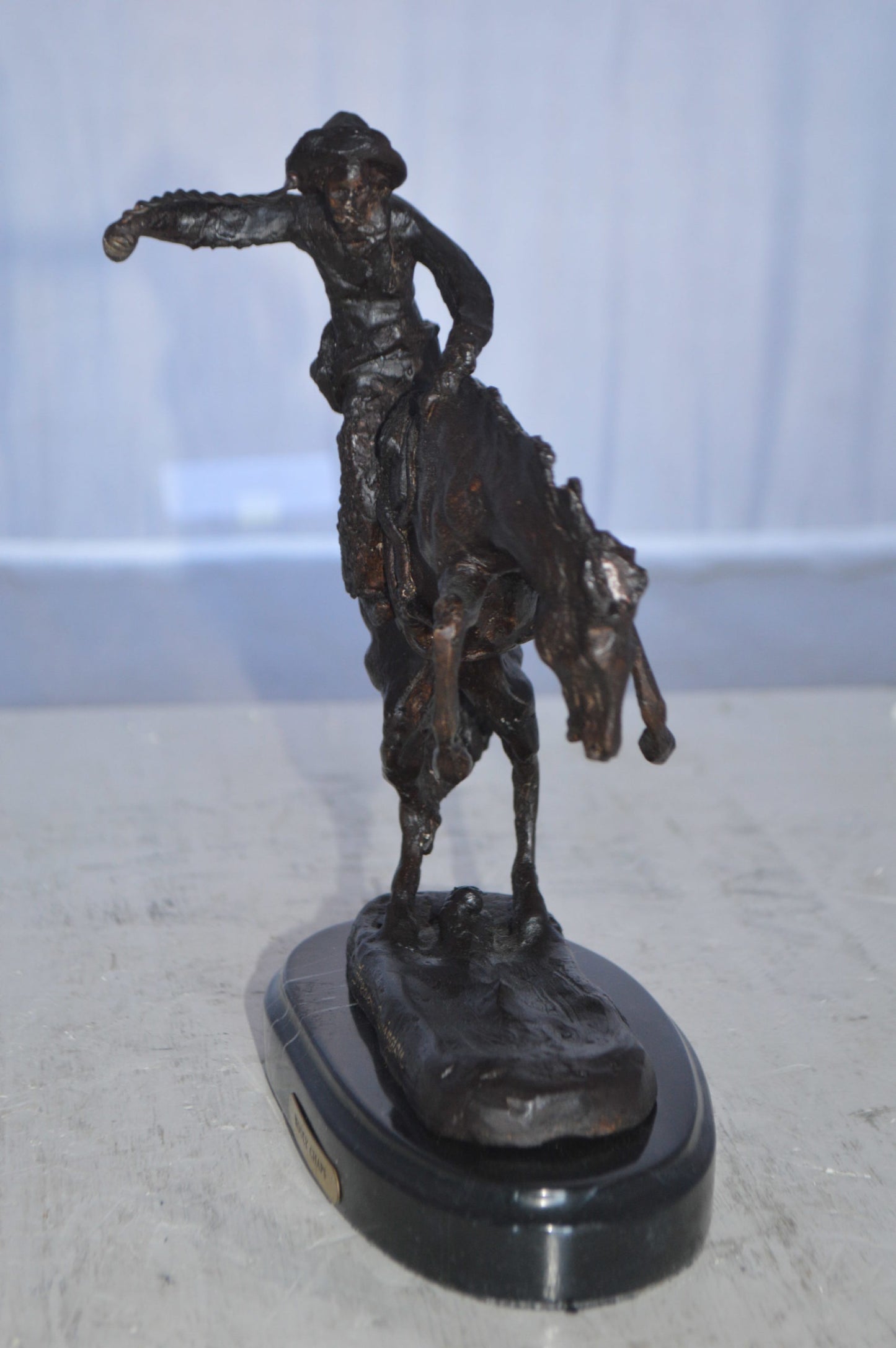 Wooly Chaps Bronze Statue by Remington 13H -  Size: 8"L x 3"W x 9"H.