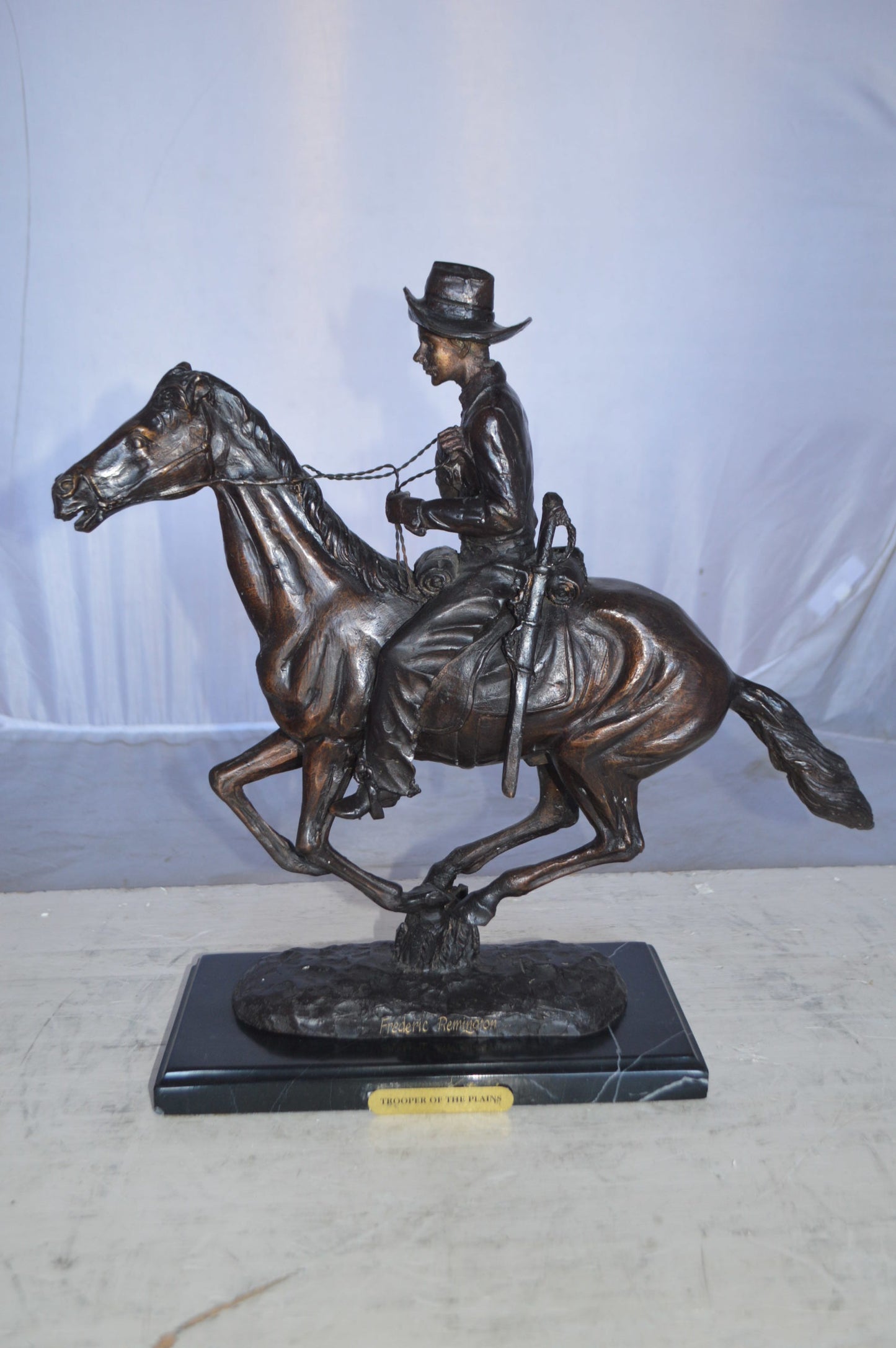 Trooper of the plains Bronze replica by Remington - Size: 17"L x 6"W x 18"H.