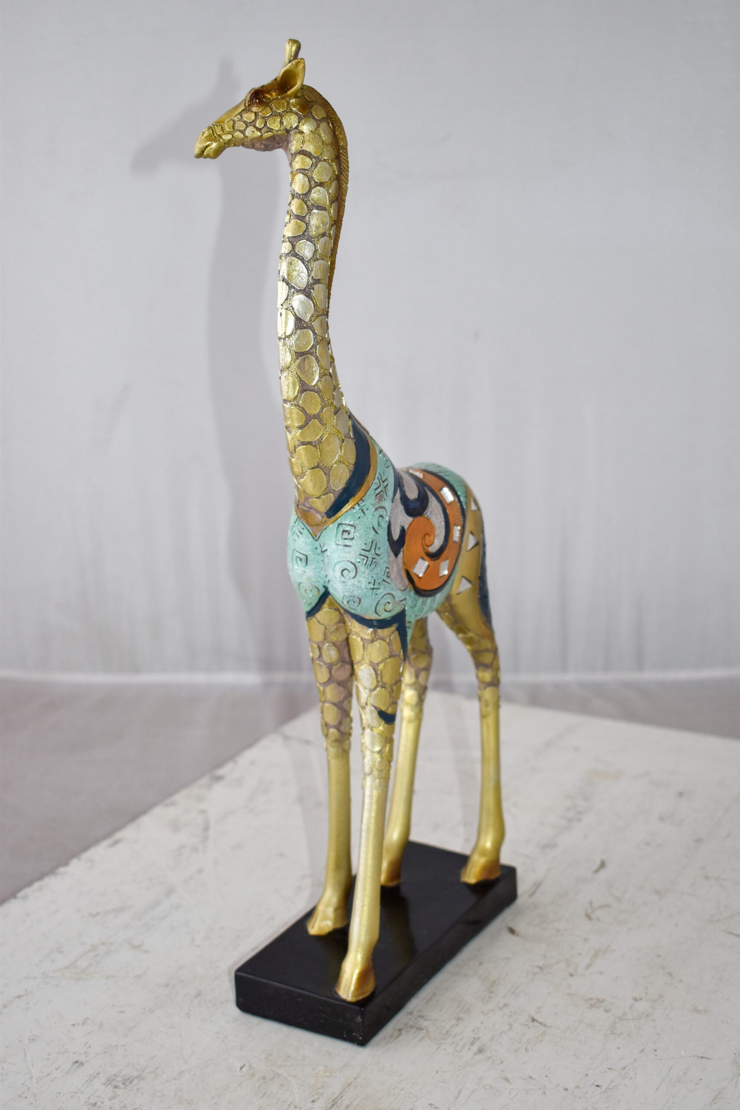 Giraffe Looking Around Colorful Resin Tabletop Statue Size: 3" x 8" x 20"H