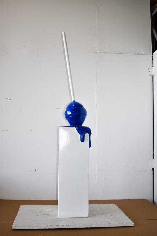 Blue Lollipop Mounted on A White Pedestal Resin Statue Size: 10" x 10" x 59"H
